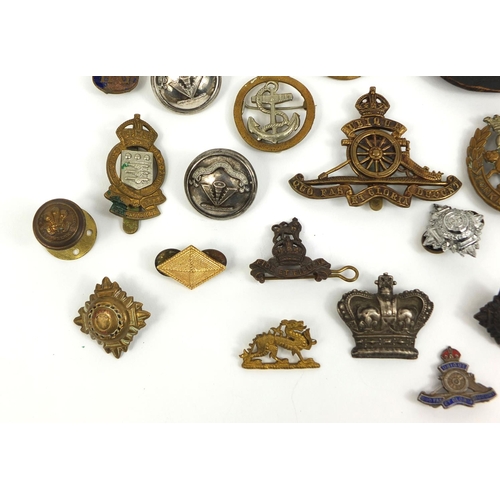 280 - Collection of British Military Naval interest cap badges and pips, together with a Christmas 1914 br... 