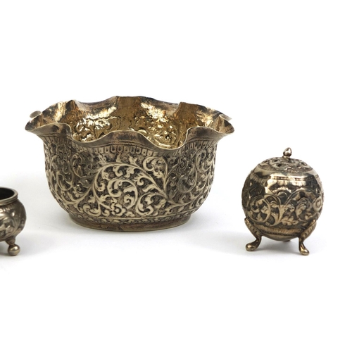 515 - Group of Middle Eastern silver coloured metal items comprising a bowl profusely embossed with foliag... 