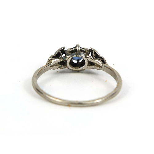 841 - Unmarked white metal sapphire and diamond ring, set with a central sapphire and six diamonds, size W... 