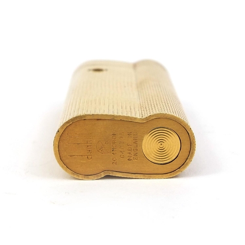 51 - Dunhill gold plated lighter with engine turned decoration, factory marks to the base, 6.5cm high