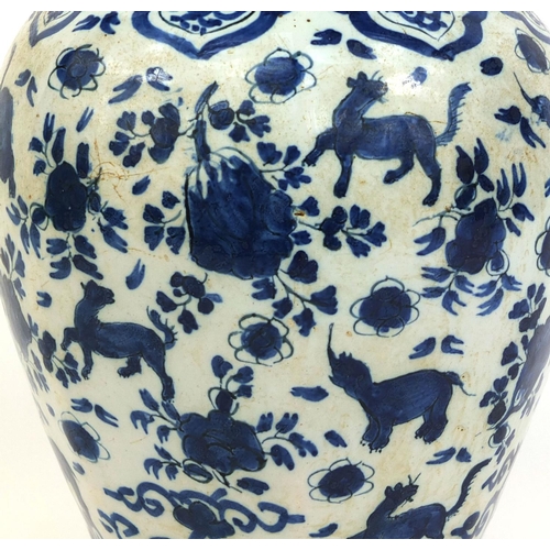 560 - Antique Delft tin glazed blue and white pottery vase, hand painted with mythical creatures amongst f... 