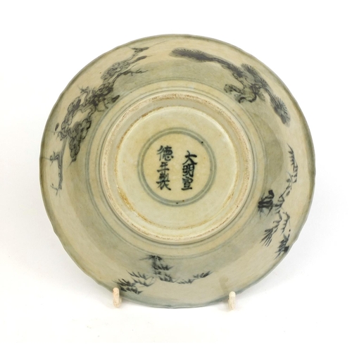 380 - Chinese porcelain bowl, hand painted with a figure within floral boarders, six figure character mark... 