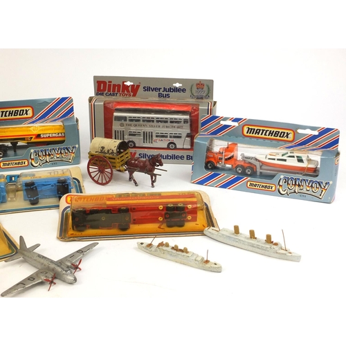 250 - Collection of vintage toys comprising two hand painted lead horse drawn carriages, two Dinky die cas... 