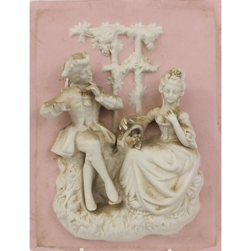 559 - Pair of continental relief moulded bisque plaques of courting couples, each 25.5cm x 19.5cm