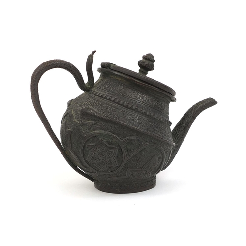 518 - Middle Eastern bronzed teapot with serpent handle profusely decorated with flowers and foliage, 14cm... 