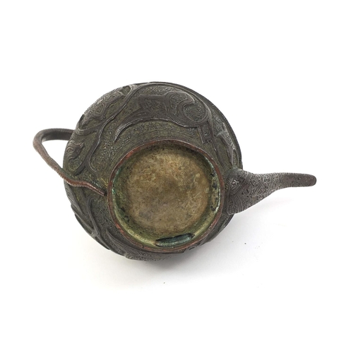 518 - Middle Eastern bronzed teapot with serpent handle profusely decorated with flowers and foliage, 14cm... 