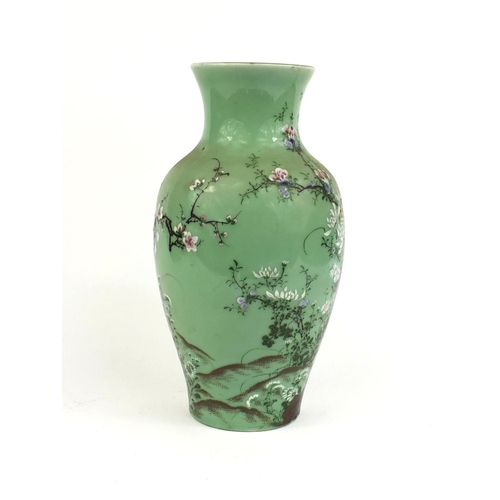 425 - Japanese porcelain vase hand painted with a bird amongst blossoming trees onto a celadon ground, six... 