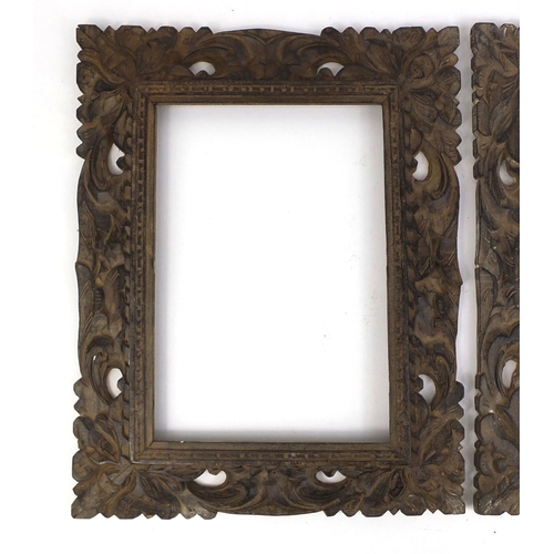 109 - Pair of rectangular hardwood frames carved with foliage, each 44cm x 33.5cm
