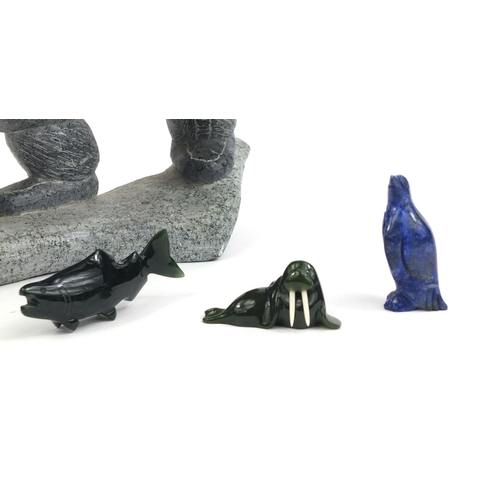 525 - Group of inuit interest carvings comprising a carved stone eskimo, Lapis Lazuli penguin, green stone... 