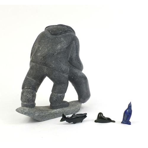 525 - Group of inuit interest carvings comprising a carved stone eskimo, Lapis Lazuli penguin, green stone... 