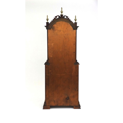 735 - Inlaid mahogany shelf clock with carved fretwork and brass urn shaped finials, the painted dial insc... 