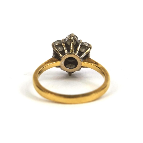 801 - 18ct gold diamond flower head ring set with seven solitaire diamonds, size J, approximate weight 3.6... 