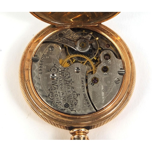 880 - Ladies gold plated full hunter pocket watch with engine turned decoration, 3.5cm in diameter, approx... 