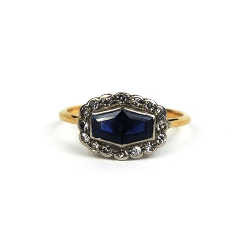 795 - 18ct gold sapphire an diamond ring, set with two sapphires and sixteen diamonds, size K, approximate... 