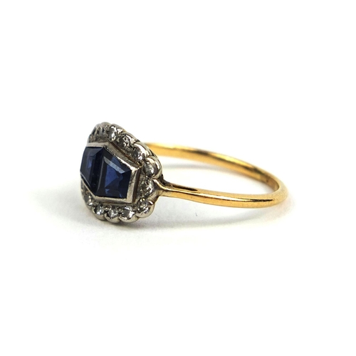 795 - 18ct gold sapphire an diamond ring, set with two sapphires and sixteen diamonds, size K, approximate... 