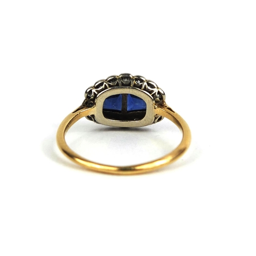 795 - 18ct gold sapphire an diamond ring, set with two sapphires and sixteen diamonds, size K, approximate... 