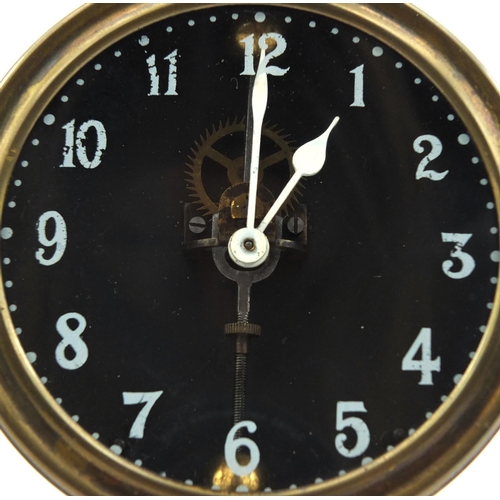 739 - Brass cased gravity clock with circular dial and Arabic Numerals, 26cm high