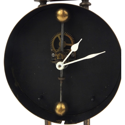 739 - Brass cased gravity clock with circular dial and Arabic Numerals, 26cm high