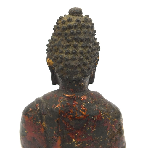 465 - Sino Tibetan bronze Buddha seated in the Lotus position, remnants of gilding and paint, 15cm high