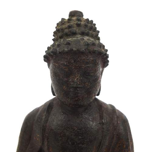 465 - Sino Tibetan bronze Buddha seated in the Lotus position, remnants of gilding and paint, 15cm high