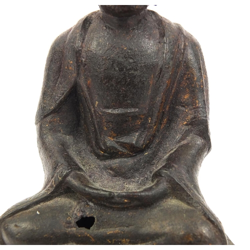 465 - Sino Tibetan bronze Buddha seated in the Lotus position, remnants of gilding and paint, 15cm high