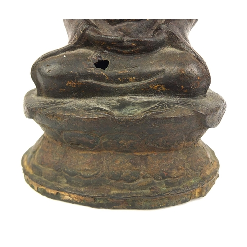 465 - Sino Tibetan bronze Buddha seated in the Lotus position, remnants of gilding and paint, 15cm high