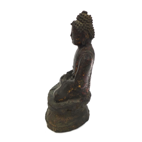 465 - Sino Tibetan bronze Buddha seated in the Lotus position, remnants of gilding and paint, 15cm high