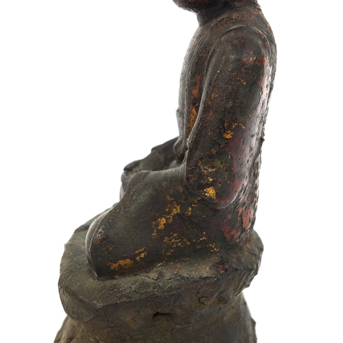 465 - Sino Tibetan bronze Buddha seated in the Lotus position, remnants of gilding and paint, 15cm high