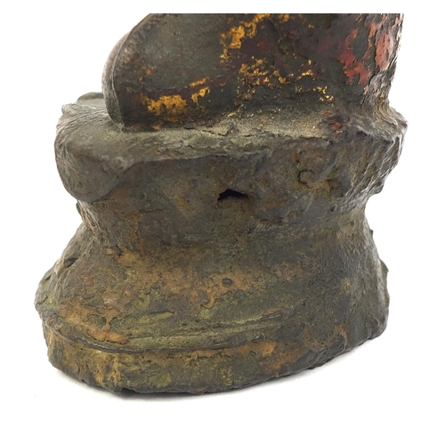 465 - Sino Tibetan bronze Buddha seated in the Lotus position, remnants of gilding and paint, 15cm high