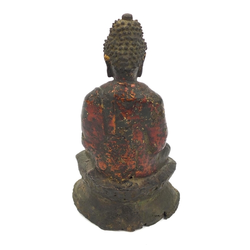 465 - Sino Tibetan bronze Buddha seated in the Lotus position, remnants of gilding and paint, 15cm high