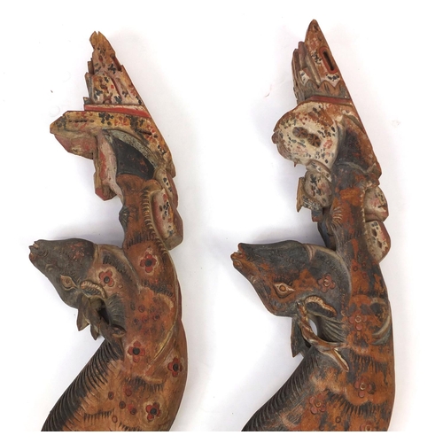 480 - Two Chinese carved wooden struts in the form of deer's, both hand painted, each 91cm high