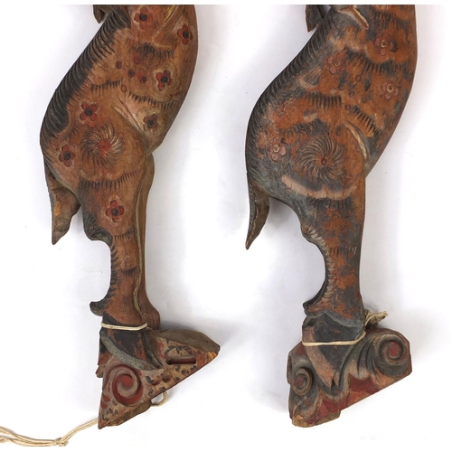 480 - Two Chinese carved wooden struts in the form of deer's, both hand painted, each 91cm high