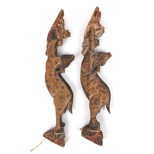 480 - Two Chinese carved wooden struts in the form of deer's, both hand painted, each 91cm high