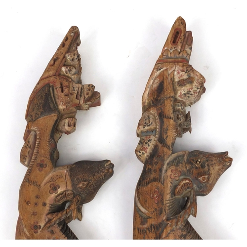 480 - Two Chinese carved wooden struts in the form of deer's, both hand painted, each 91cm high