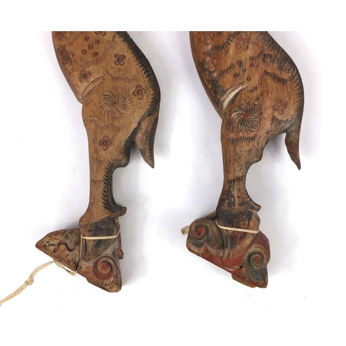 480 - Two Chinese carved wooden struts in the form of deer's, both hand painted, each 91cm high