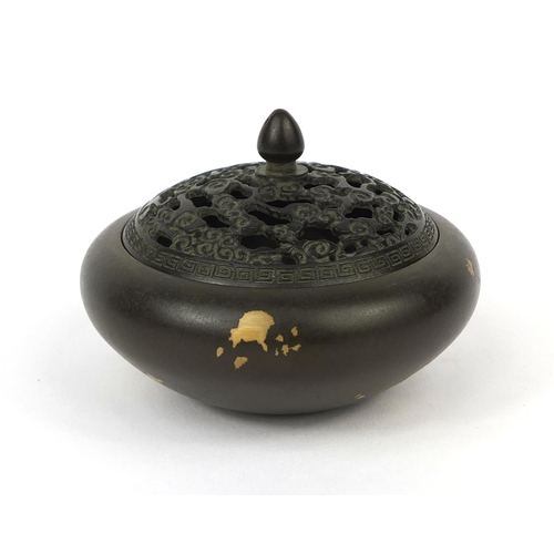 471 - Chinese bronze incense burner, the lid with pierced decoration, character marks to the base, 9.5cm i... 