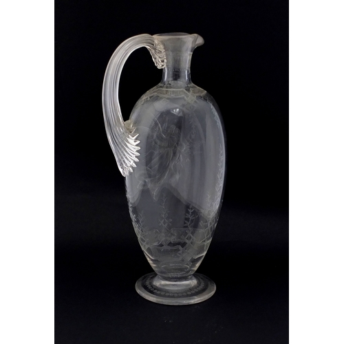 569 - 19th Century glass wine jug engraved with a guardian angel and child above a floral border, etched v... 