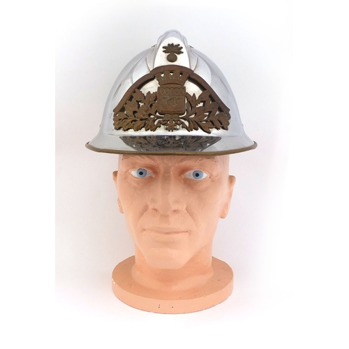 352 - French fire tin helmet with Fluctuat Nec Mergitur badge, and one other badge Sapeurs Ponpiers Clermo... 