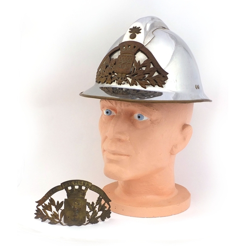 352 - French fire tin helmet with Fluctuat Nec Mergitur badge, and one other badge Sapeurs Ponpiers Clermo... 