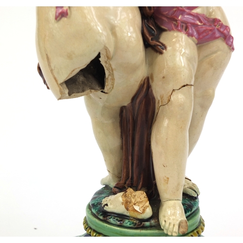 531 - Victorian Minton Majolica pottery candlestick modelled as a pair of  dancing putti with pink ribbons... 