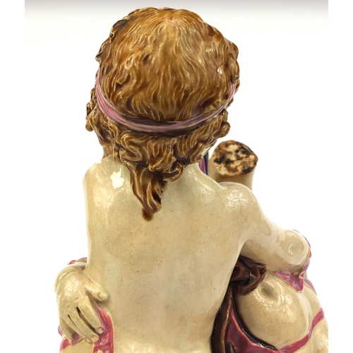 531 - Victorian Minton Majolica pottery candlestick modelled as a pair of  dancing putti with pink ribbons... 