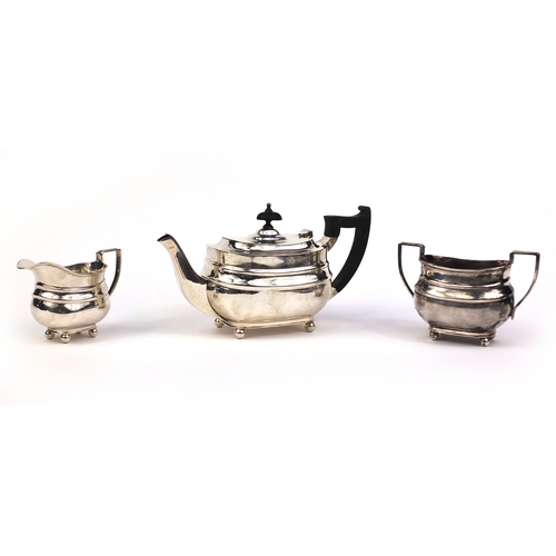 659 - Silver three piece tea service, the teapot with ebonised wood handle and knop, indistinct makers mar... 