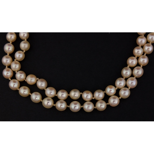 758 - Two row pearl necklace on a diamond clasp, set with ten solitaire diamonds, 40cm long, approximate w... 