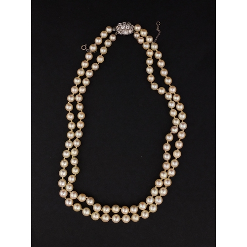 758 - Two row pearl necklace on a diamond clasp, set with ten solitaire diamonds, 40cm long, approximate w... 