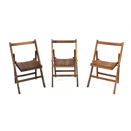 2056 - Group of three Military interest War Department/Air Ministry fold down chairs, each 83cm high
