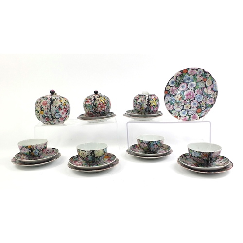 373 - Chinese porcelain part tea service, hand painted in the famille noire palette with flowers onto a bl... 