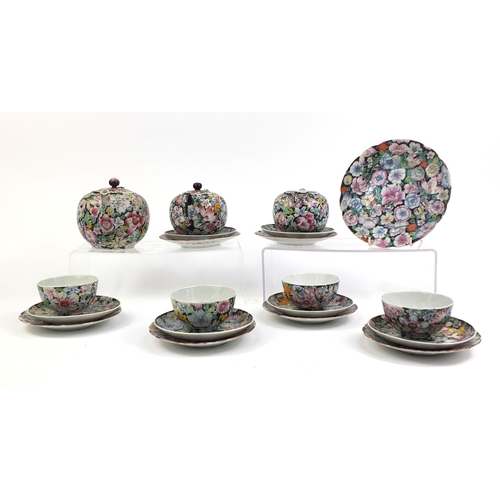 373 - Chinese porcelain part tea service, hand painted in the famille noire palette with flowers onto a bl... 