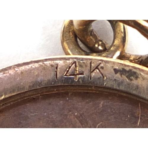 838 - 14ct gold circular locket with engine turned decoration to the back, 2.5cm in diameter, approximate ... 