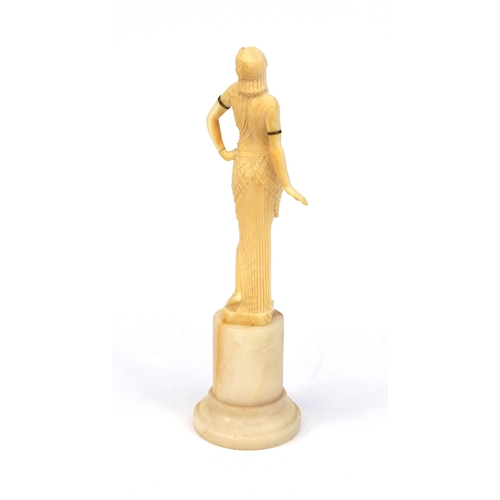 629 - Art Deco Joe Descomps carved ivory figure of a semi clad female wearing a draping dress, raised on a... 