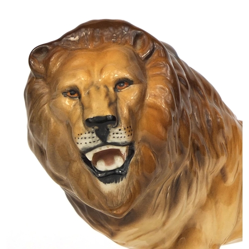 2101 - Beswick model lion, original paper label and factory marks to the base, 14cm high